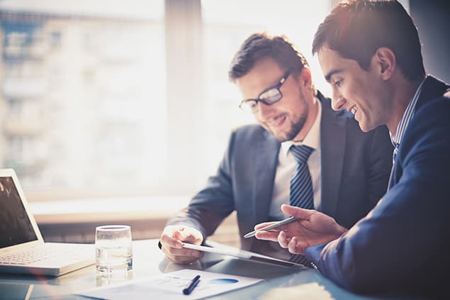 Two young professionals working together