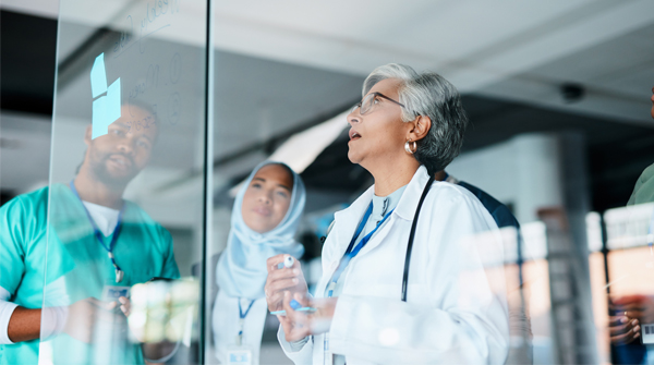 A group of medical professionals confer.