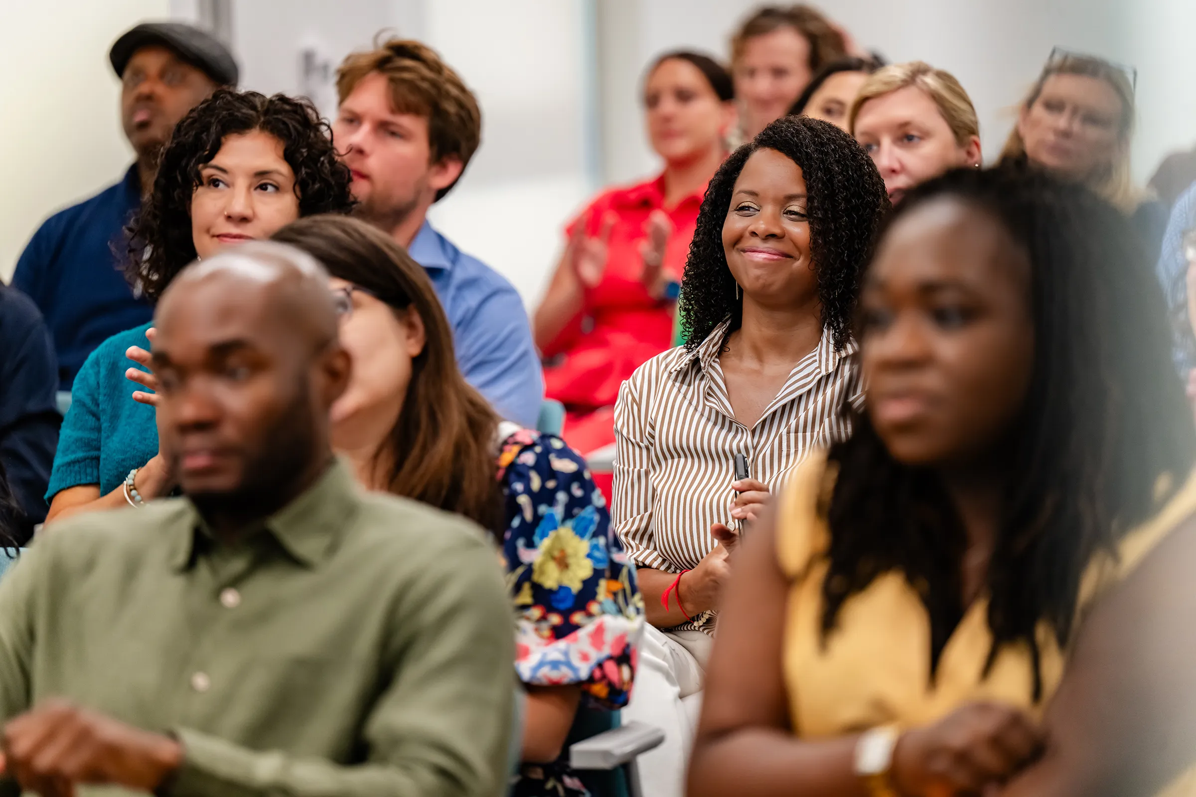 A woman smiles at a WES event in Washington D.C.